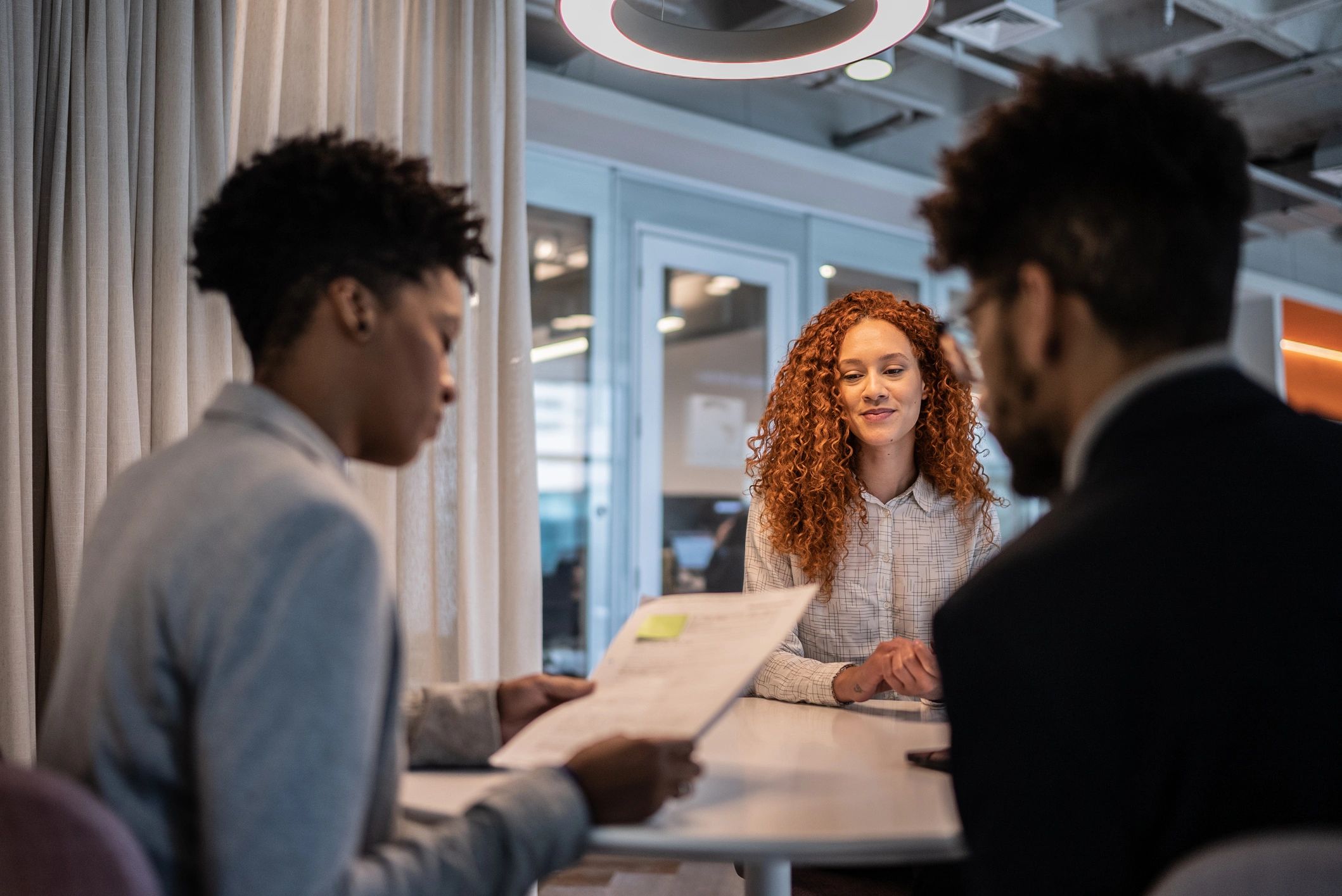 Candidate meeting with a hiring team in an office