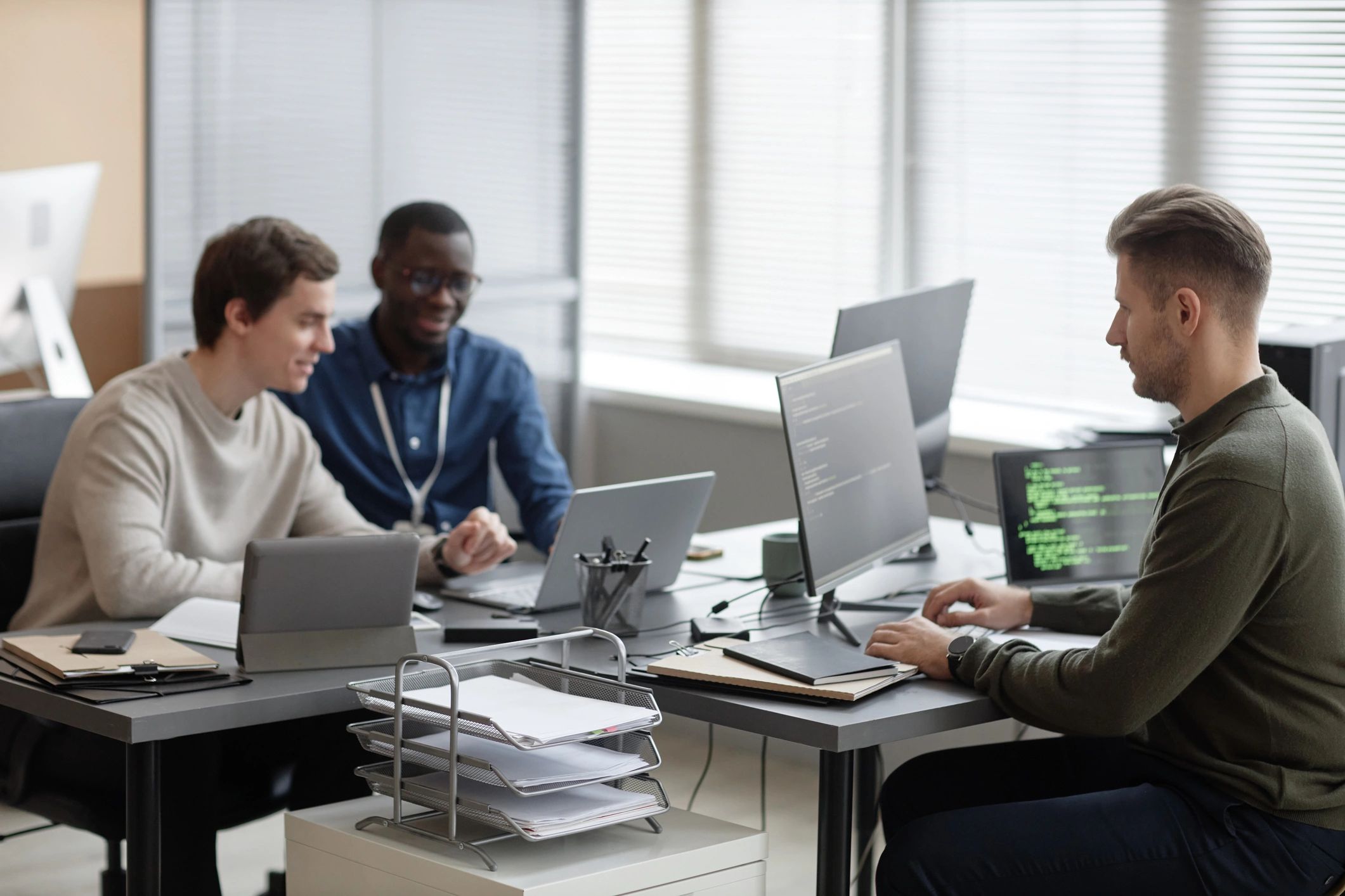 Programmers working together in a modern office