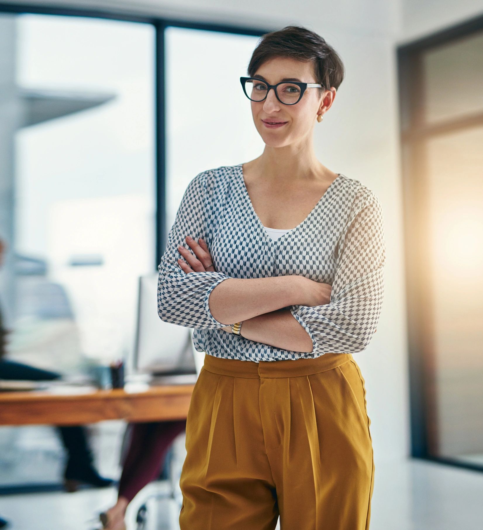 Confident professional standing in an office